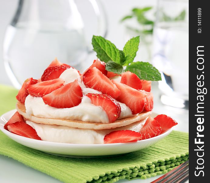 Pancakes with curd cheese and fresh strawberries