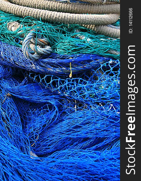 Blue fishing tools, fish net background