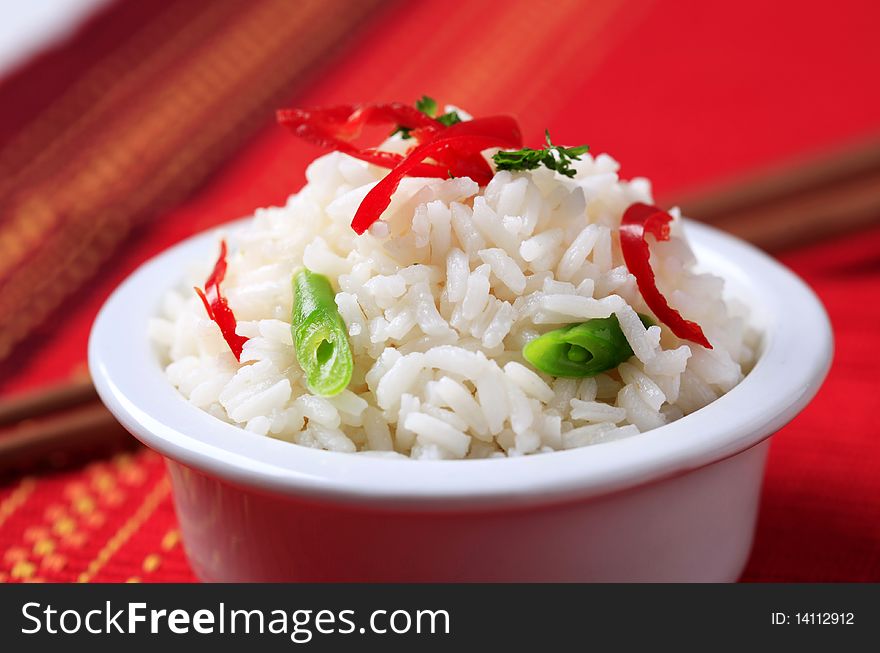 Bowl of white rice styled with vegetables. Bowl of white rice styled with vegetables