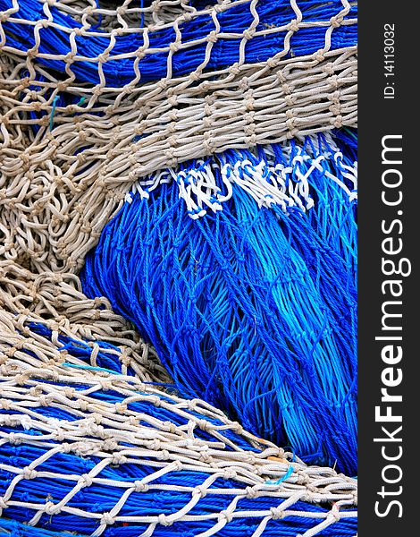 Close up shot of a Blue & white fisn net. background. fisihng material. Close up shot of a Blue & white fisn net. background. fisihng material.