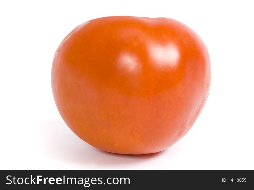 One ripe tomato isolated on the white background. One ripe tomato isolated on the white background