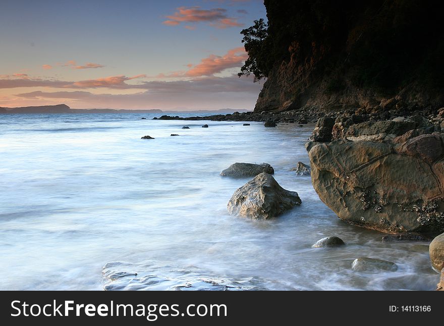 A beautiful sunset with rocky shoreline