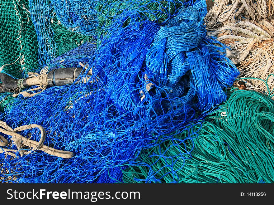 Close up shot of a Blue & white fish nets background. fishing material. Close up shot of a Blue & white fish nets background. fishing material.