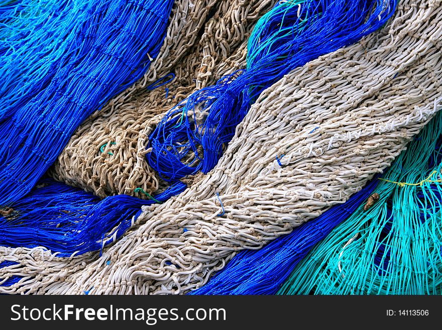 Close up shot of a Blue & white fish nets background. fishing material. Close up shot of a Blue & white fish nets background. fishing material.