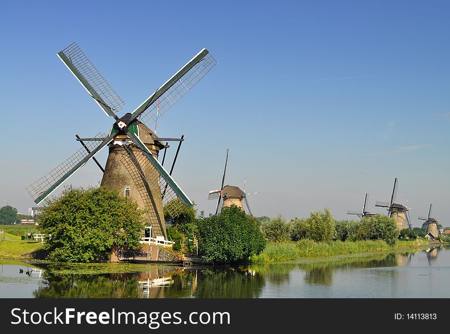 Dutch Mills Over A River