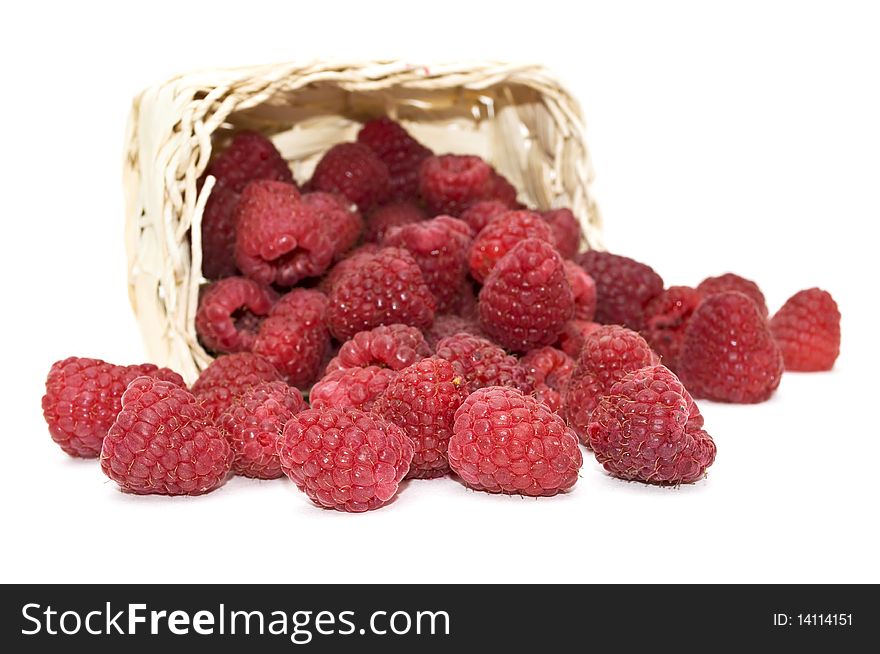 Bright, fresh raspberries in a basket on a white background . Bright, fresh raspberries in a basket on a white background ...