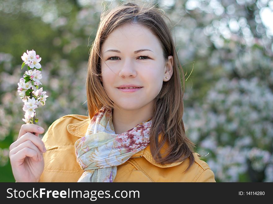 Young Woman In Blooming Park