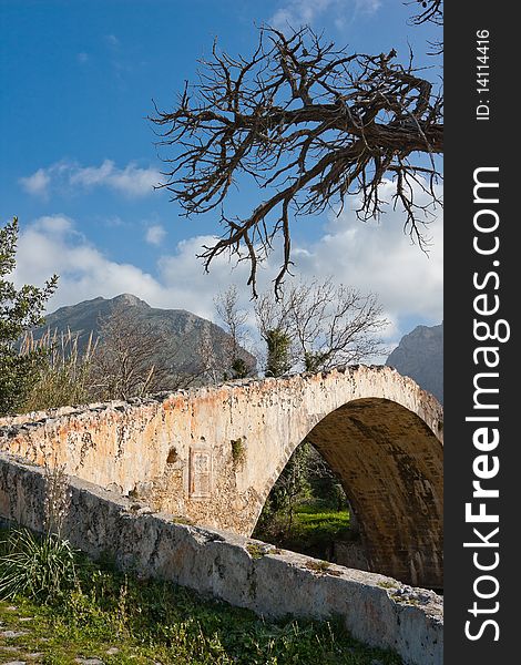 Old arched Venetian Bridge at Preveli in Crete, Greece