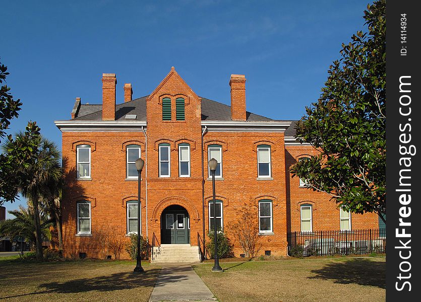 East entrance of the Old Calhoun County Courthouse, in the early morning winter sun, was built in 1904 is an historic building located at 314 East Central Avenue in Blountstown, Florida. On October 16, 1980, it was added to the U.S. National Register of Historic Places. In 1989, the Old Calhoun County Courthouse is considered one of two Romanesque Revival courthouses extant in Florida. East entrance of the Old Calhoun County Courthouse, in the early morning winter sun, was built in 1904 is an historic building located at 314 East Central Avenue in Blountstown, Florida. On October 16, 1980, it was added to the U.S. National Register of Historic Places. In 1989, the Old Calhoun County Courthouse is considered one of two Romanesque Revival courthouses extant in Florida.