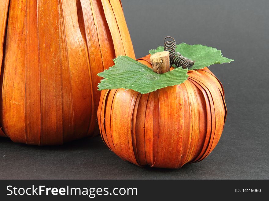 An artist interpretation of two pumpkins on a grey background. An artist interpretation of two pumpkins on a grey background.