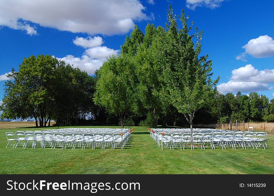 A lovely green grass wedding aisle in a rural setting. A lovely green grass wedding aisle in a rural setting.