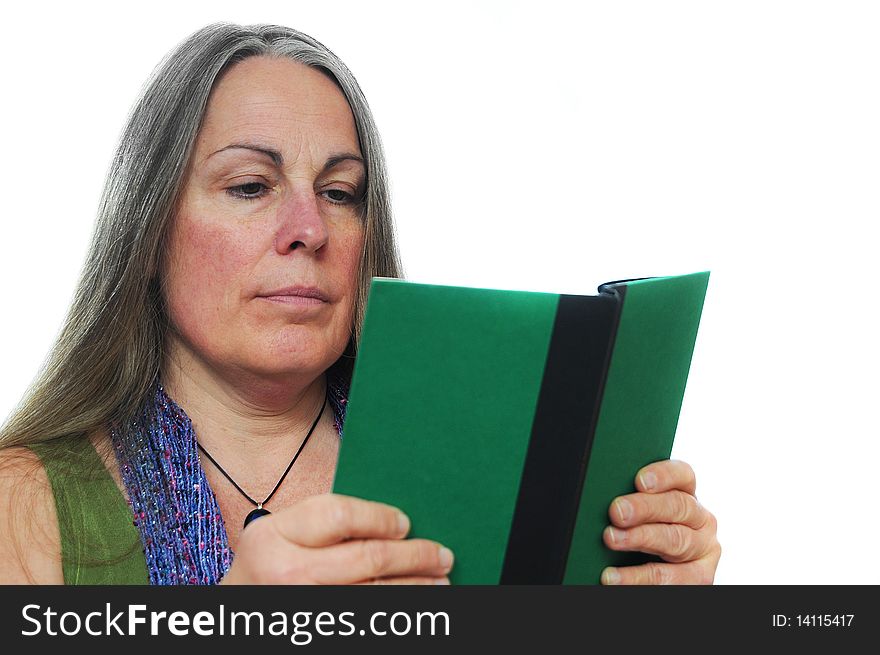 Woman reading a green hardcover book isolated on white background with room for your text. Woman reading a green hardcover book isolated on white background with room for your text