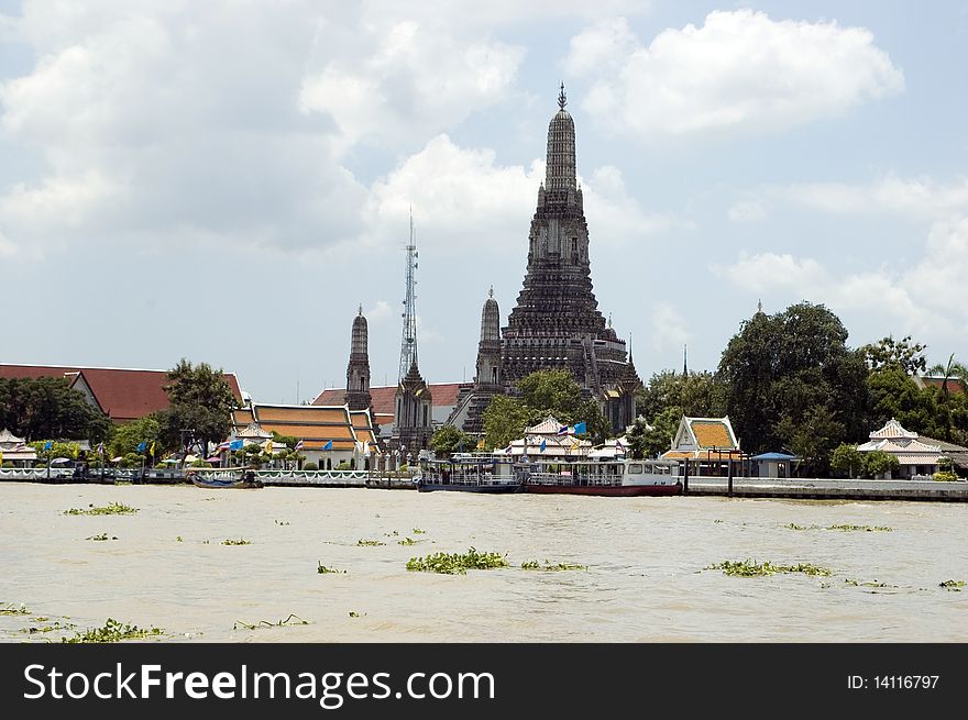 Thailand, Bangkok - general cityscape with temples and ancient buildings, view from Chao Phraya River. Thailand, Bangkok - general cityscape with temples and ancient buildings, view from Chao Phraya River.