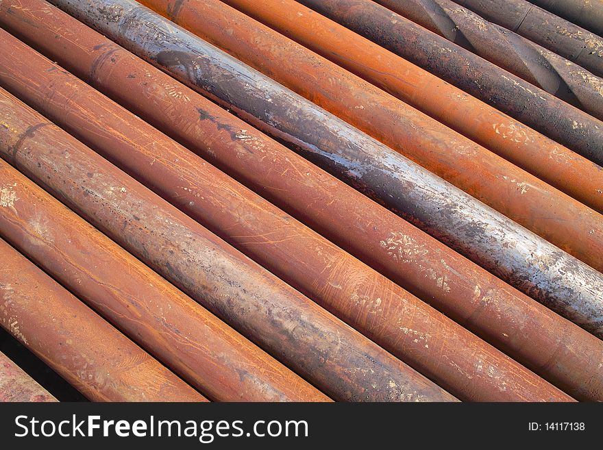 Rusty drilling pipe arranged together