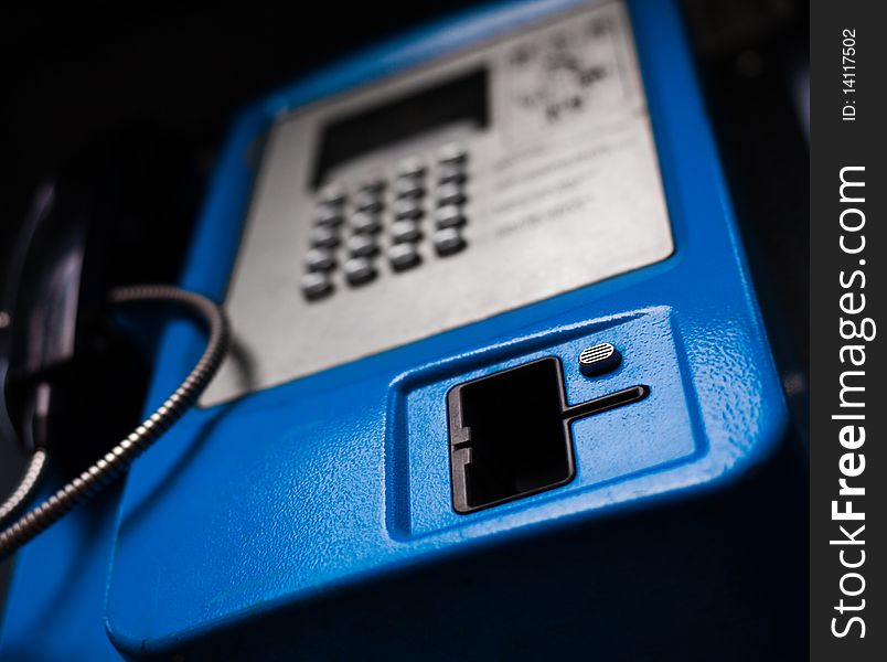 New blue public phone close-up shot. New blue public phone close-up shot