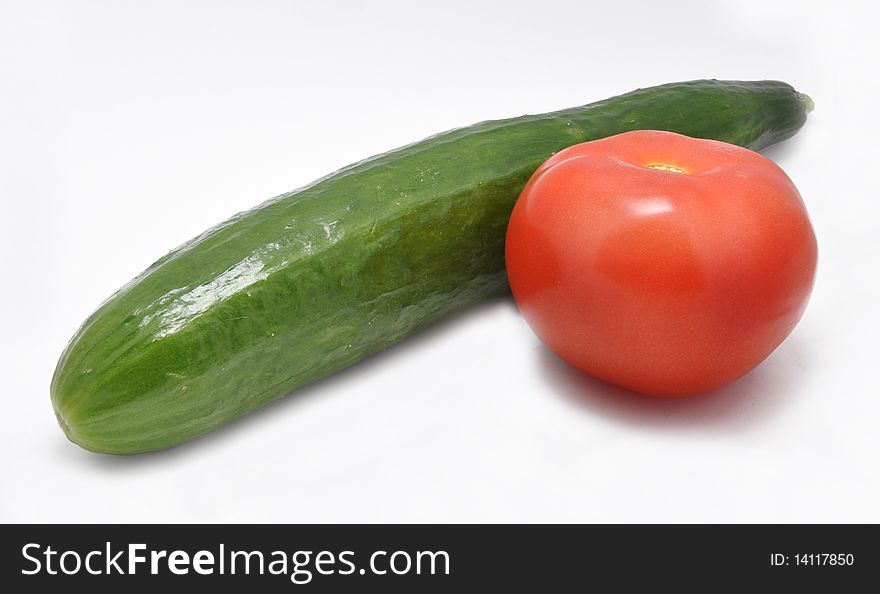 Picture of cucumber and tomato on a white background