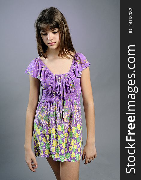 White girl expressing loneliness and posing with dress in studio. White girl expressing loneliness and posing with dress in studio