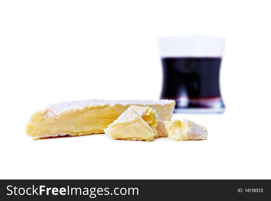 Brie cheese and gas of red wine isolated on white. Brie cheese and gas of red wine isolated on white