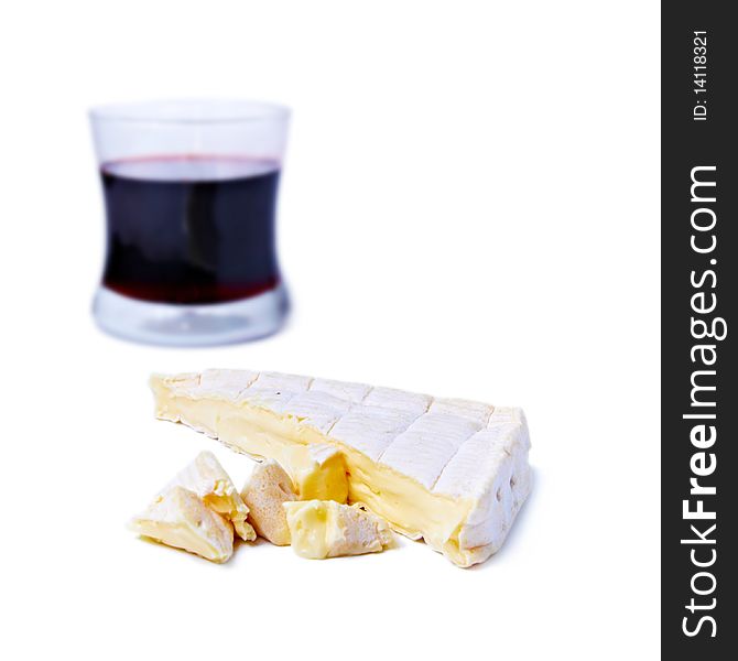 Brie cheese and gas of red wine isolated on white. Brie cheese and gas of red wine isolated on white