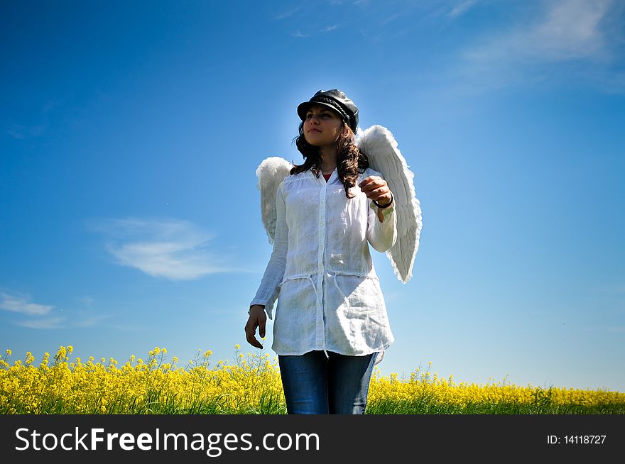 Happy girl with angel wings walking