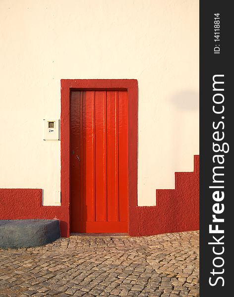 Typical colored door in Algarve. Typical colored door in Algarve.