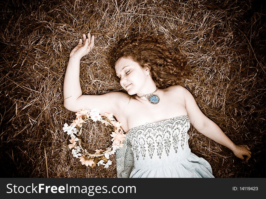 Young woman lying at tint spring grass. Young woman lying at tint spring grass