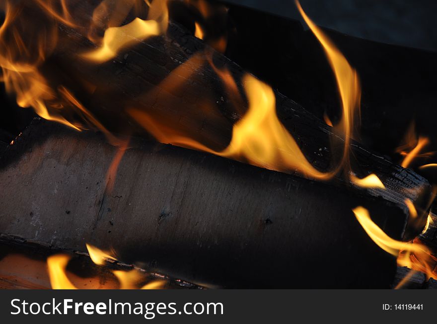 Picture of logs in flame of fire which burn out. Picture of logs in flame of fire which burn out