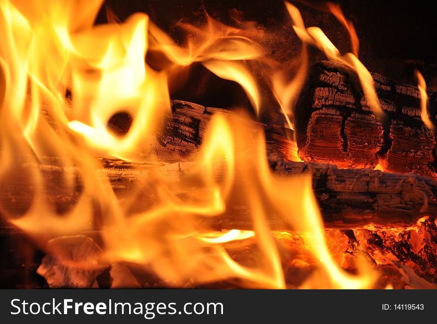 Picture of logs in flame of fire which burn