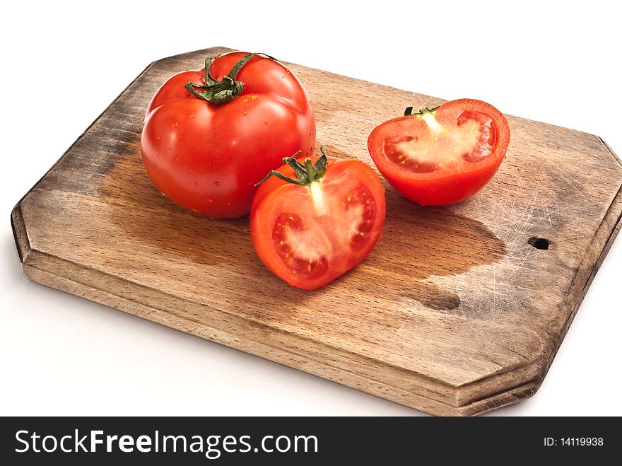 Fresh tomatoes on a worktop