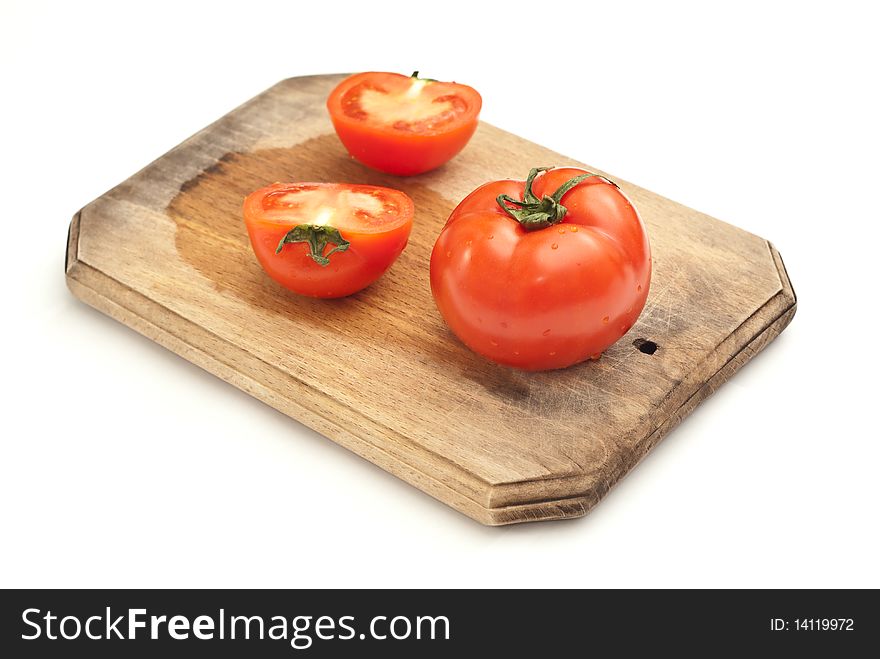 Fresh tomatoes on a worktop