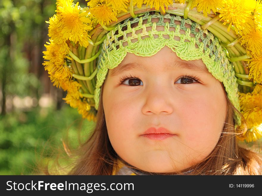 Portrait Of A Little Girl Wearing Dandelion Diadem