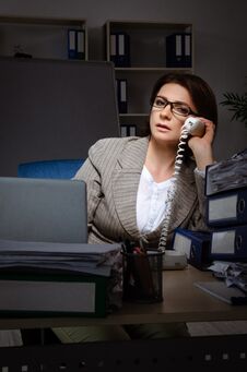 The Female Employee Suffering From Excessive Work Royalty Free Stock Photos
