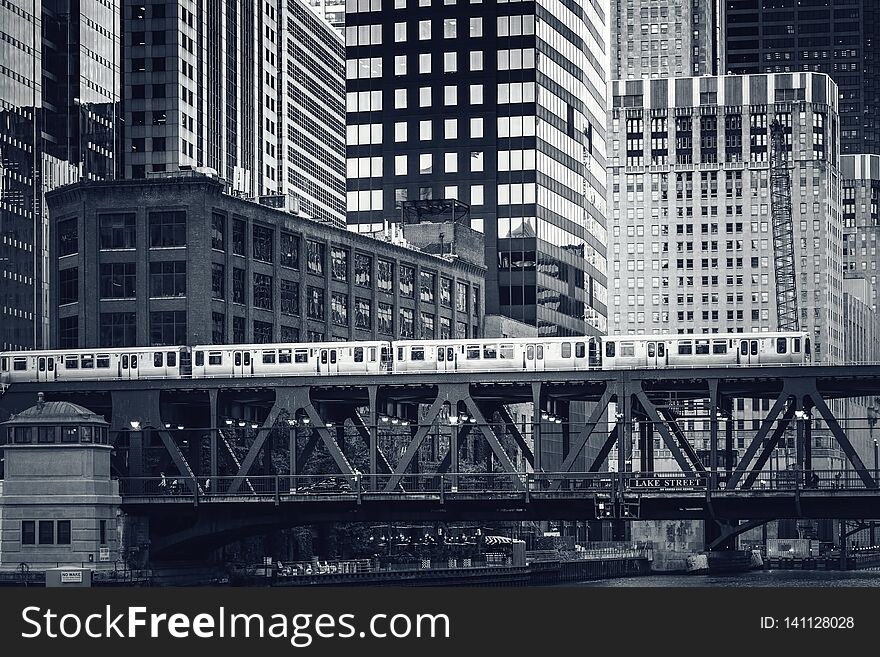 Black and white view of elevated railway train in Chicago, USA
