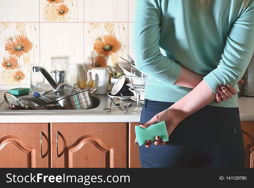 Fragment of the female body at the kitchen counter, filled with