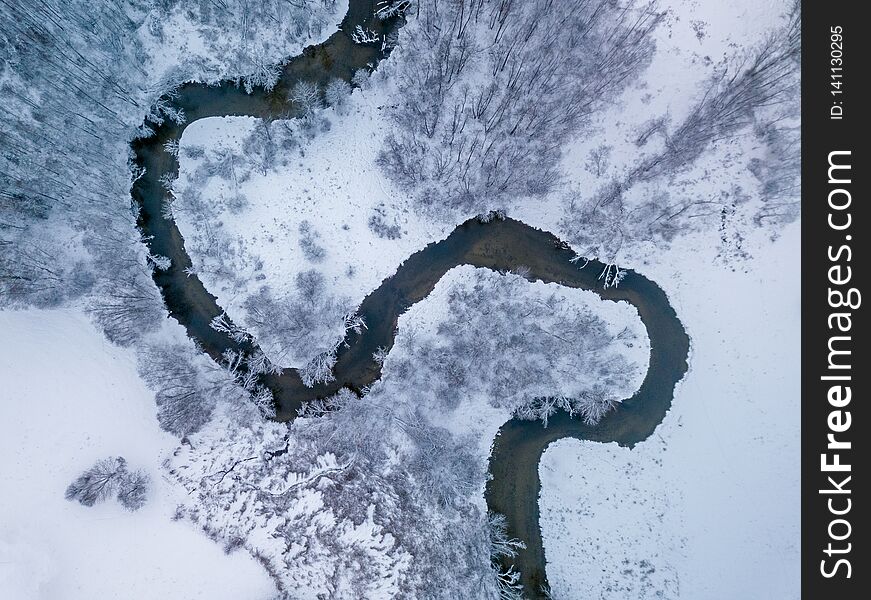 Aerial view of forest river in time of winter day. Aerial view of forest river in time of winter day.