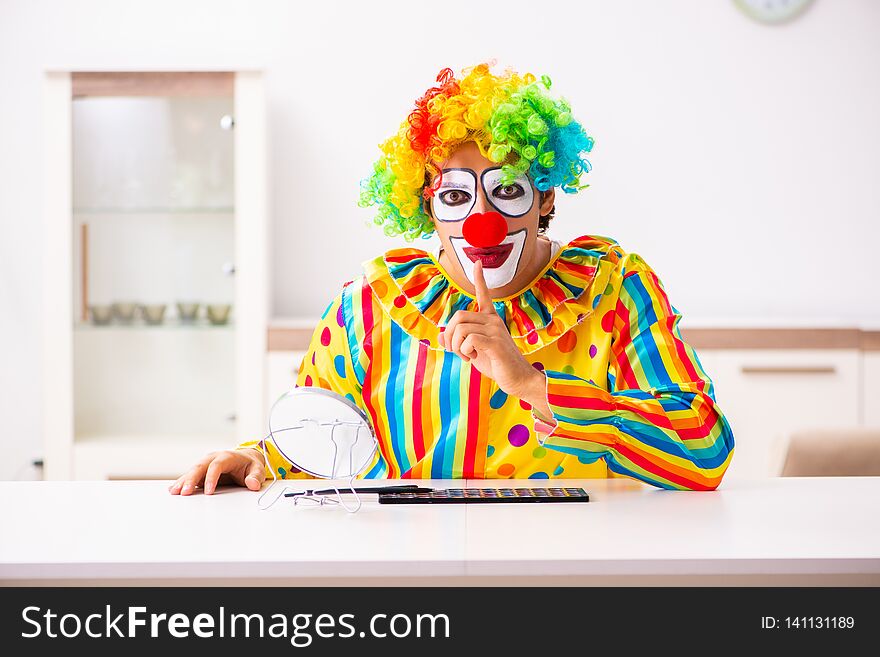 The Male Clown Preparing For Perfomance At Home