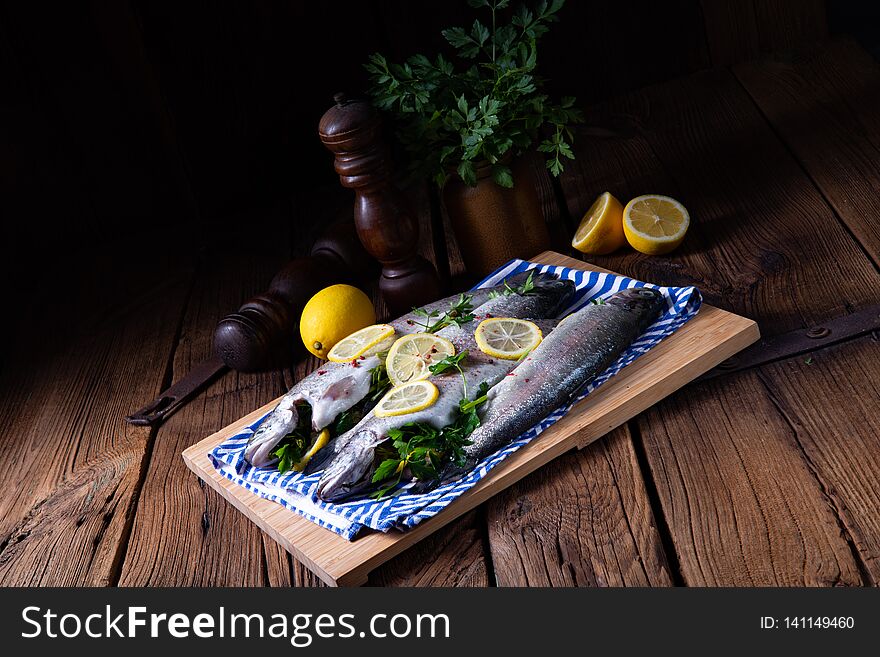 Fresh trout with lemon and different herbs
