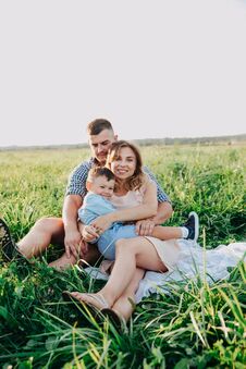 Free Happy Family Enjoying Together In Summer Day. Family Sitting On Grass Stock Photos - 141178433