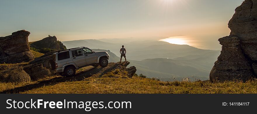 Man with car on beauty nature landscape background