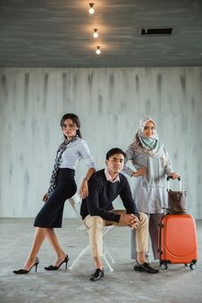 Free Three Confident Model Wearing Casual Clothes Pose In The Hall Stock Image - 141193481