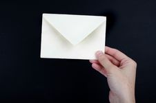 Hand Holding A White Envelope Stock Photography