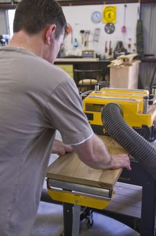 Man Planing Board With Machine Planer Royalty Free Stock Images Man Planing Board With Machine Planer Royalty Free Stock Images