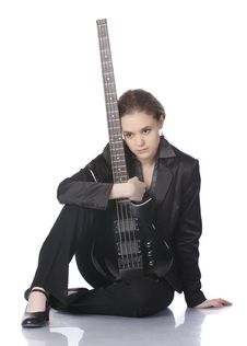 Seated Girl With A Black Electric Bass Guitar Stock Photos Seated Girl With A Black Electric Bass Guitar Stock Photos