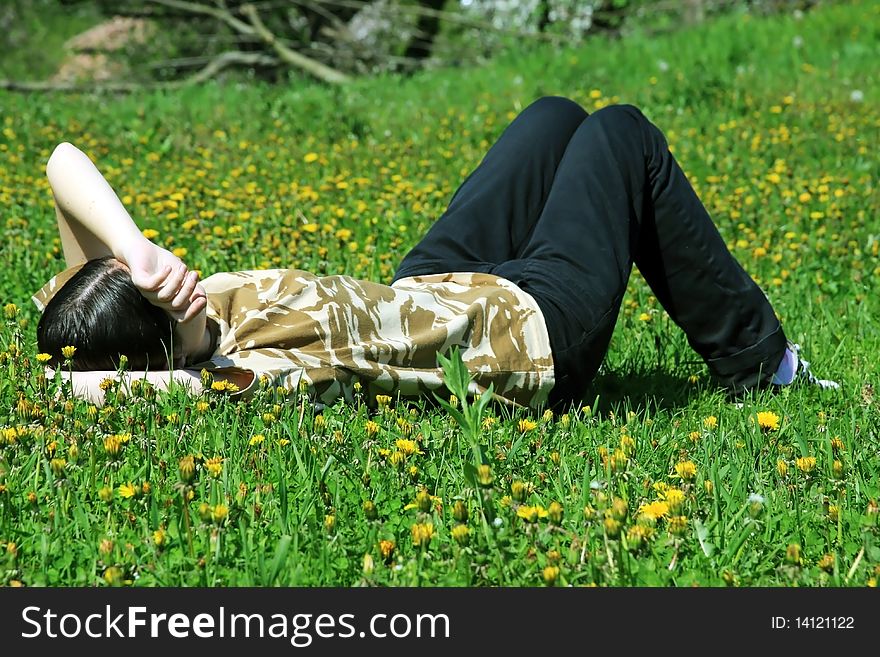 Girl Dreaming On The Grass