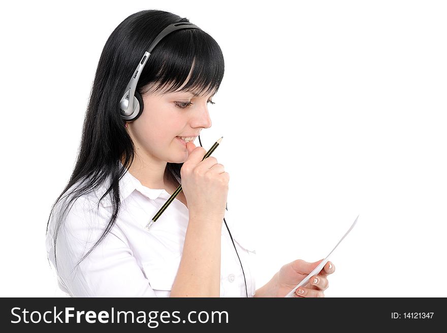 Beautiful young woman in headphones smiles in current of telephone conversation on a white background. Beautiful young woman in headphones smiles in current of telephone conversation on a white background