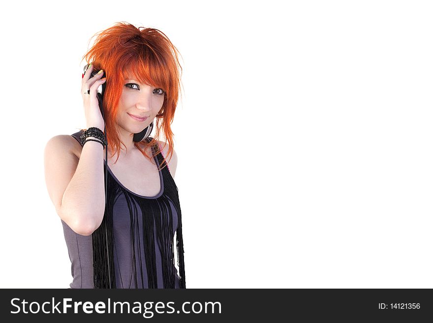Redhead young woman holding headphones. Redhead young woman holding headphones