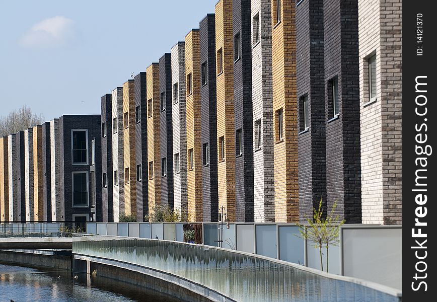 A row of new brick houses in contrasting colors. A row of new brick houses in contrasting colors.