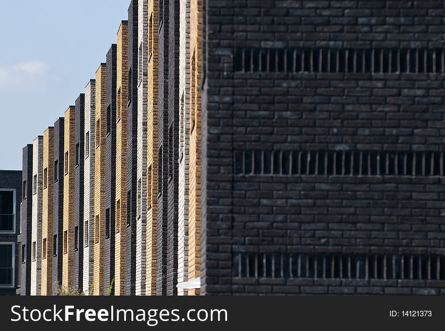 A row of new brick houses in contrasting colors. A row of new brick houses in contrasting colors.