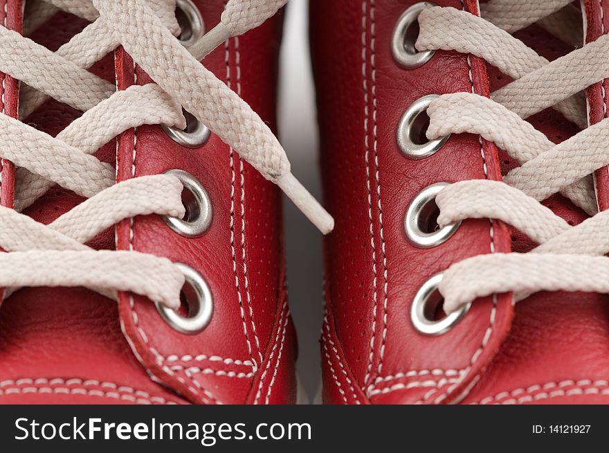Red leather sneakers close up