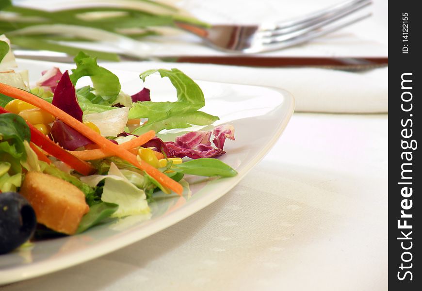 Vegetables mixed salad on bowl with fork